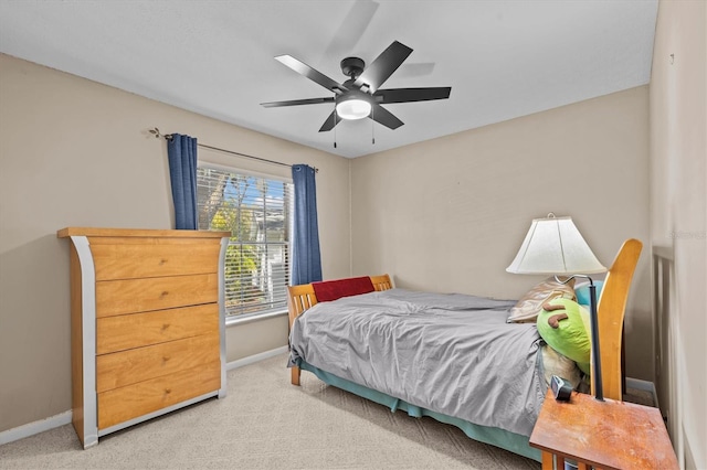 bedroom featuring carpet flooring, a ceiling fan, and baseboards