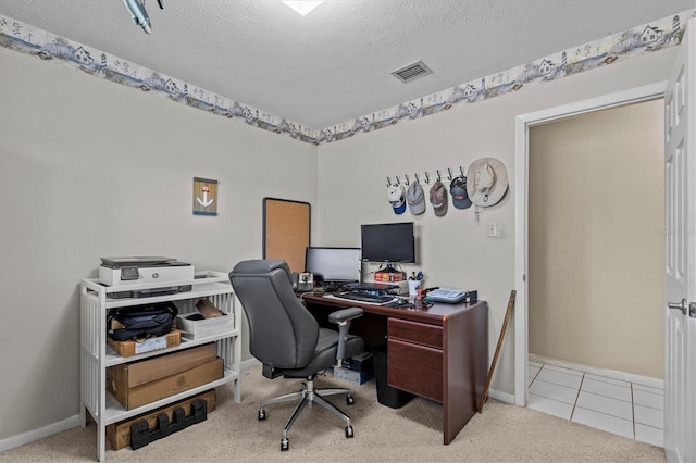 carpeted home office featuring visible vents, a textured ceiling, baseboards, and tile patterned floors