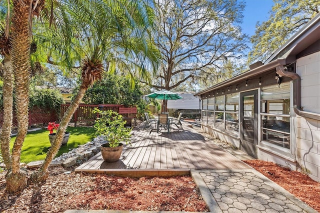 wooden terrace with outdoor dining area