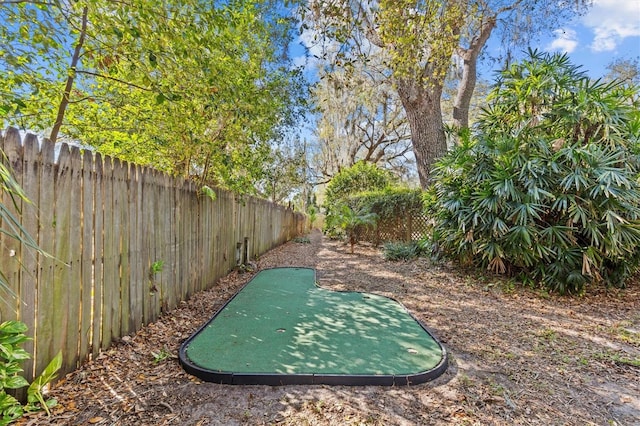 view of property's community with a fenced backyard