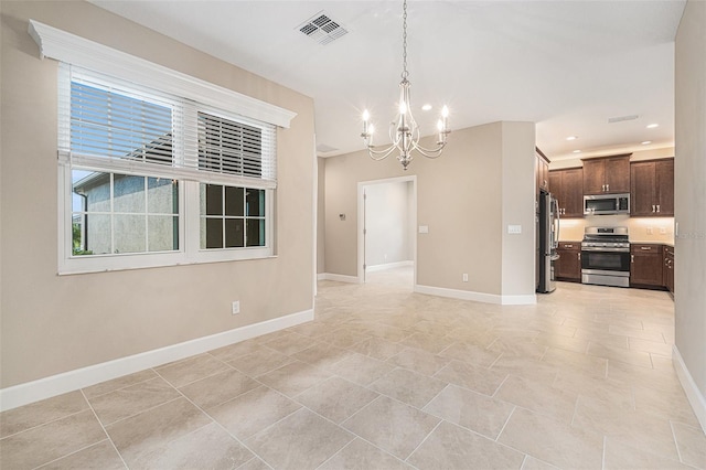 interior space with baseboards, visible vents, a chandelier, and recessed lighting