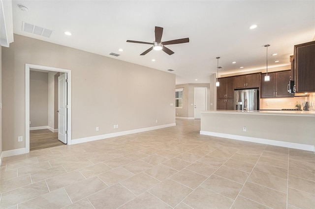 unfurnished living room featuring ceiling fan, visible vents, baseboards, and recessed lighting