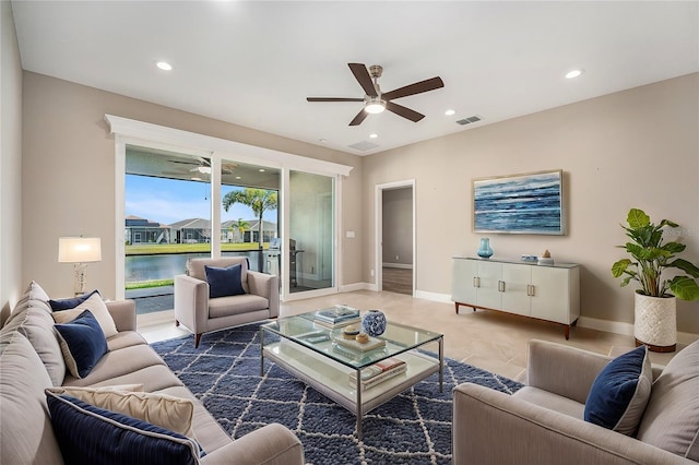 living room with ceiling fan, visible vents, and recessed lighting