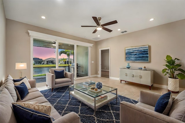 living room featuring baseboards, recessed lighting, visible vents, and a ceiling fan