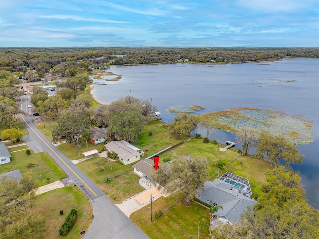 birds eye view of property with a water view