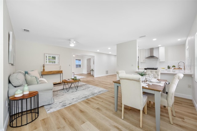 living room with visible vents, recessed lighting, light wood finished floors, baseboards, and ceiling fan