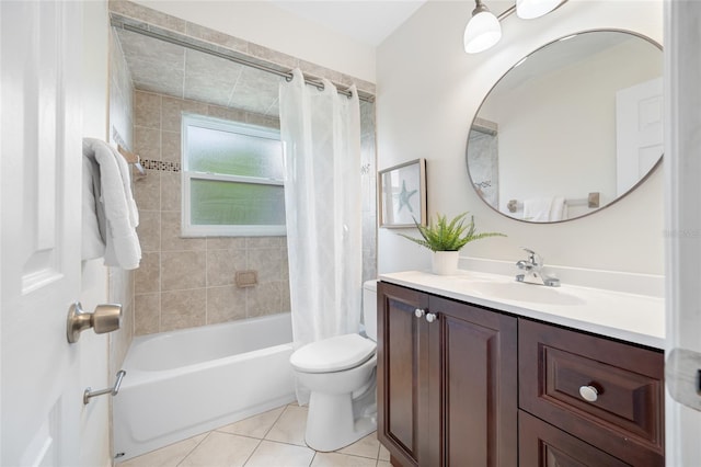 full bathroom with tile patterned floors, shower / bath combo with shower curtain, toilet, and vanity