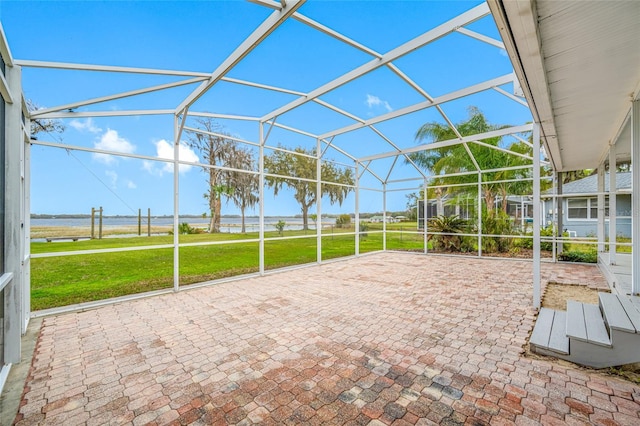 view of patio with glass enclosure