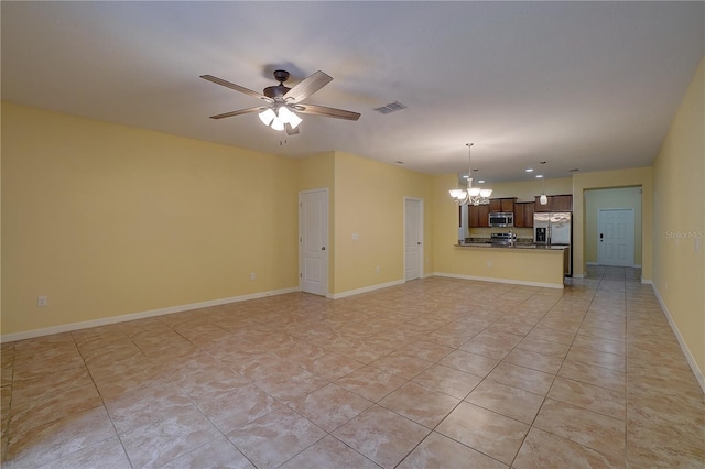 unfurnished living room with ceiling fan with notable chandelier, light tile patterned floors, visible vents, and baseboards