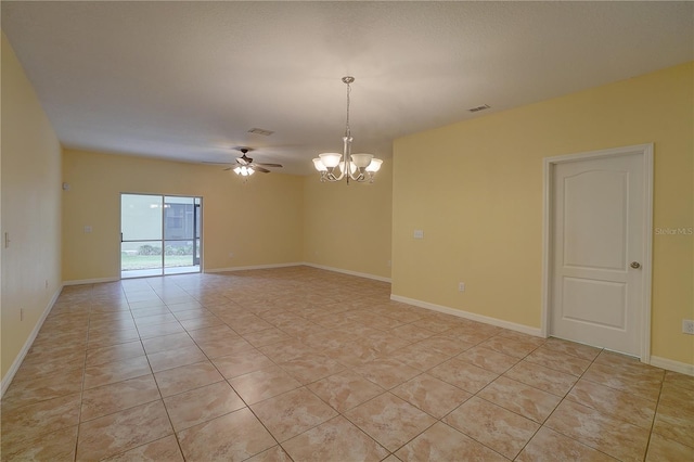 unfurnished room featuring ceiling fan with notable chandelier, light tile patterned flooring, visible vents, and baseboards