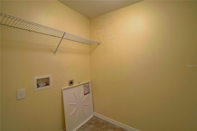 laundry area featuring laundry area, hookup for a washing machine, baseboards, and hookup for an electric dryer