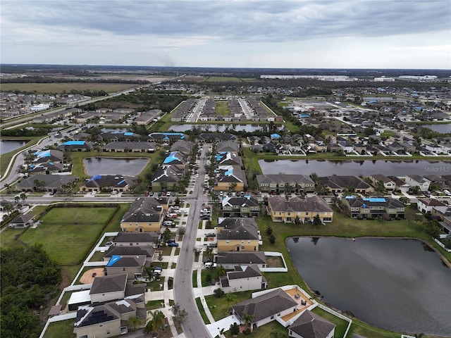 aerial view with a residential view and a water view