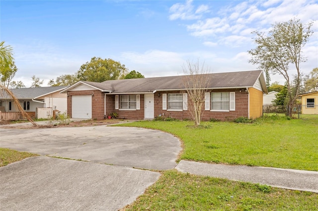 ranch-style home featuring driveway, an attached garage, fence, a front lawn, and brick siding