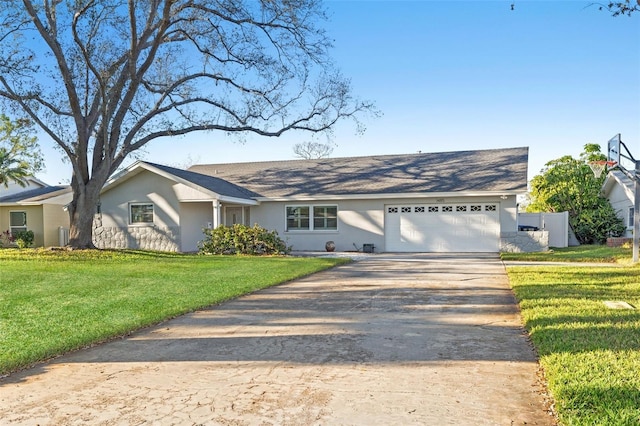 ranch-style home with driveway, an attached garage, a front lawn, and stucco siding