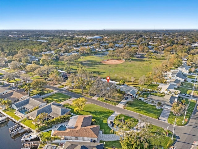 drone / aerial view featuring a residential view and a water view