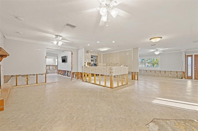 living room with a ceiling fan, visible vents, and crown molding