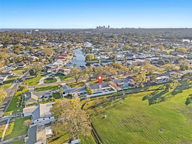 drone / aerial view with a residential view and a water view