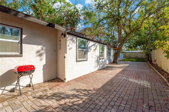 view of patio / terrace with a fenced backyard and a grill