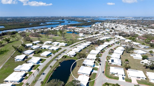 1320 Bottlebrush Dr, Bradenton, FL 34208 - aerial perspective of suburban area with a large body of water