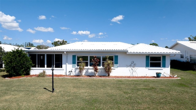 1320 Bottlebrush Dr, Bradenton, FL 34208 - back of house with a lawn and stucco siding