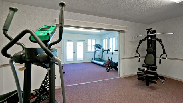 1320 Bottlebrush Dr, Bradenton, FL 34208 - workout area with french doors, carpet, wallpapered walls, and a textured ceiling