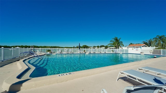 1320 Bottlebrush Dr, Bradenton, FL 34208 - community pool featuring a patio