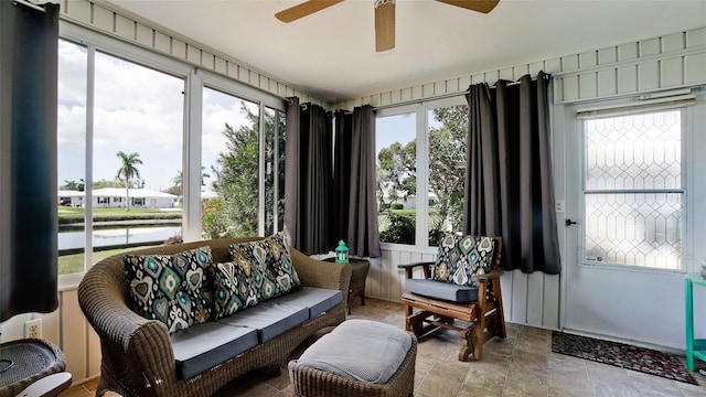 1320 Bottlebrush Dr, Bradenton, FL 34208 - living room featuring ceiling fan, a water view, and stone finish flooring