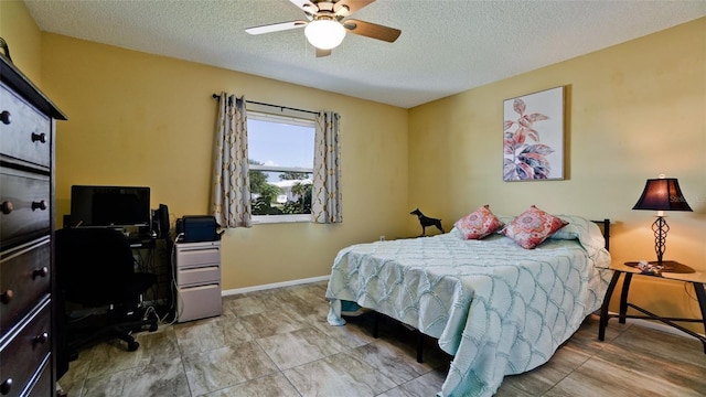 1320 Bottlebrush Dr, Bradenton, FL 34208 - bedroom featuring a textured ceiling, a desk, a ceiling fan, and baseboards