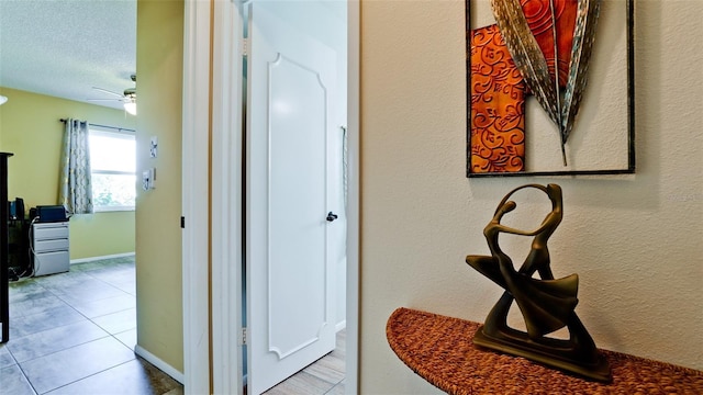 1320 Bottlebrush Dr, Bradenton, FL 34208 - hallway with tile patterned floors and a textured ceiling