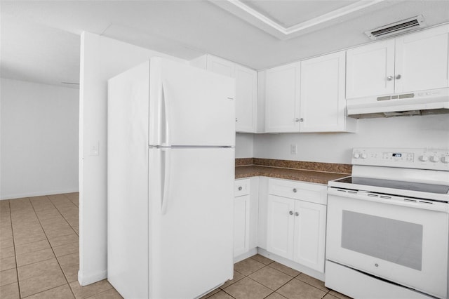 kitchen with white appliances, light tile patterned flooring, visible vents, and under cabinet range hood