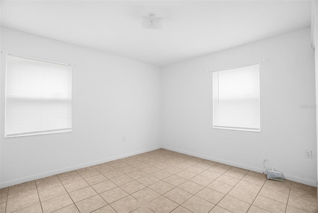 empty room featuring baseboards