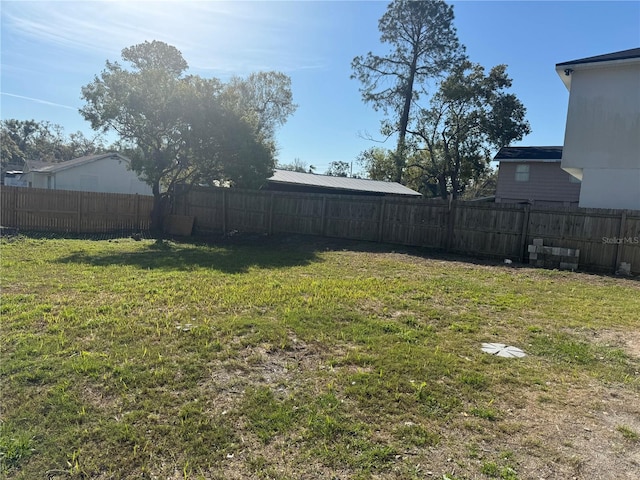 view of yard featuring a fenced backyard