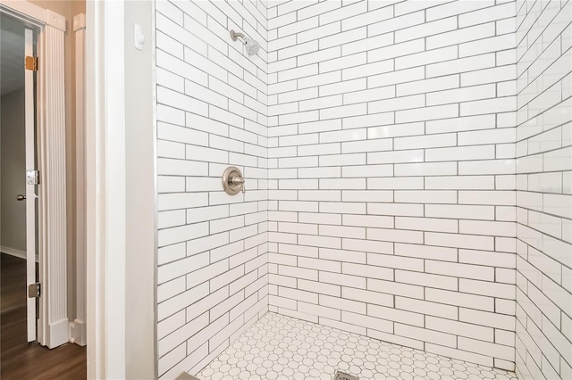 bathroom with tiled shower