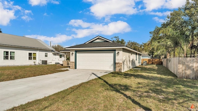 view of side of home featuring a garage, central AC, fence, a yard, and driveway