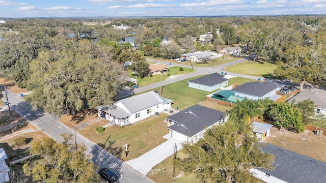 birds eye view of property with a wooded view and a residential view