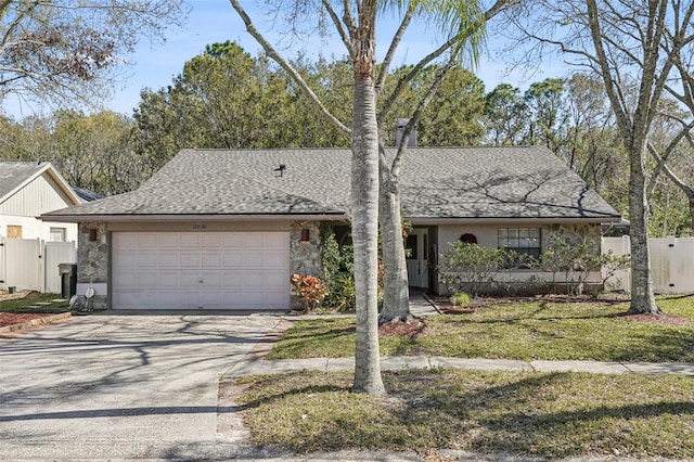 single story home featuring stone siding, fence, and roof with shingles