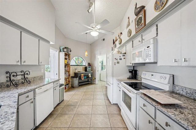 kitchen with white appliances, light tile patterned floors, white cabinets, ceiling fan, and a textured ceiling