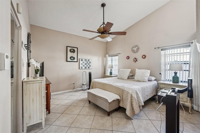 bedroom featuring light tile patterned floors, high vaulted ceiling, a textured ceiling, ceiling fan, and baseboards