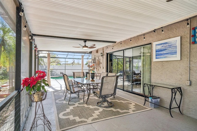 sunroom featuring ceiling fan and a wealth of natural light