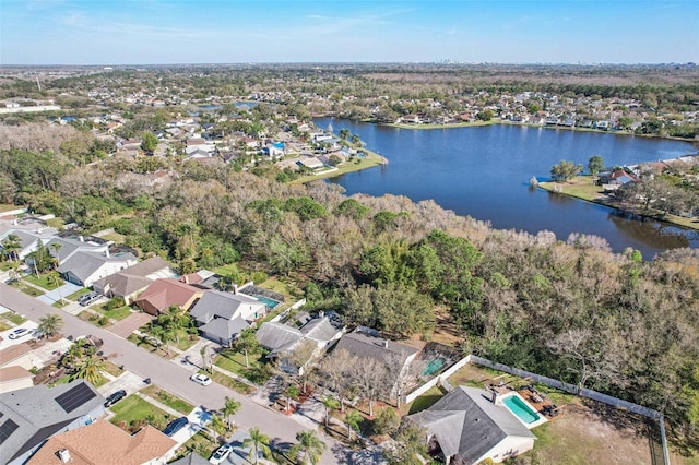 bird's eye view featuring a residential view and a water view