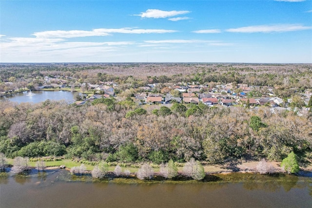 drone / aerial view featuring a water view and a residential view