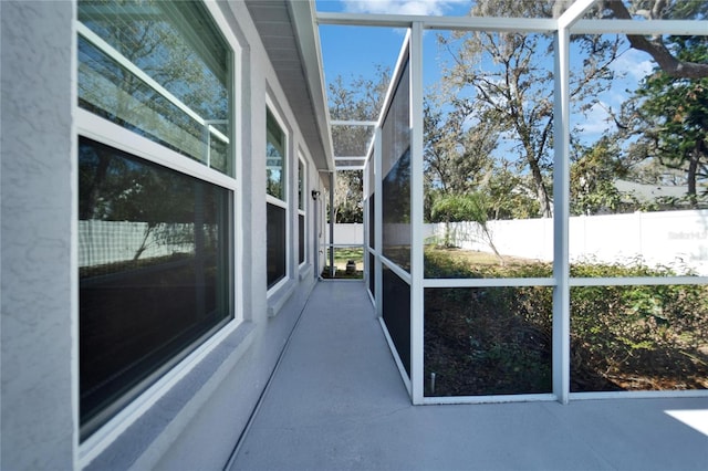 unfurnished sunroom featuring a healthy amount of sunlight