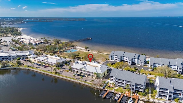 drone / aerial view featuring a water view and a residential view