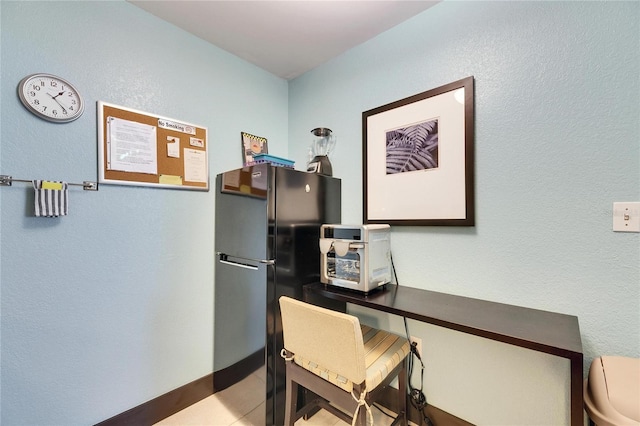 office area with tile patterned floors