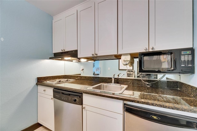 kitchen with black microwave, white cabinetry, dishwasher, and a sink