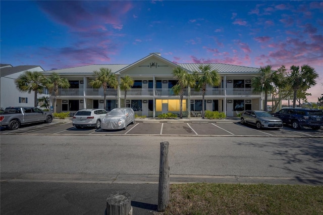 view of property featuring uncovered parking