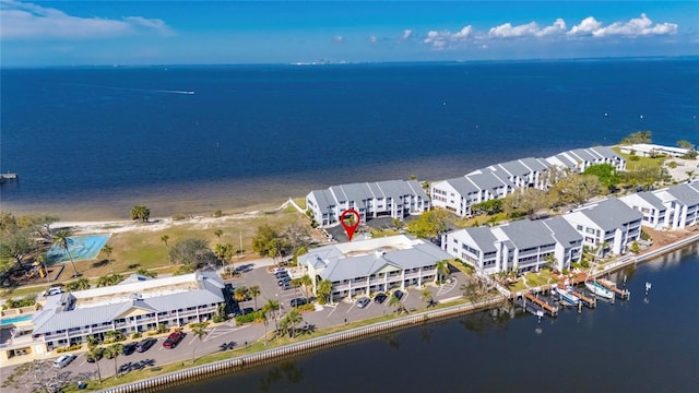 drone / aerial view with a water view and a residential view