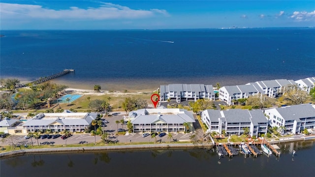 drone / aerial view featuring a water view and a residential view