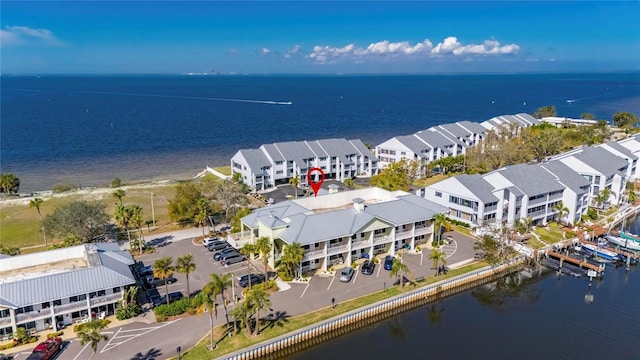 birds eye view of property with a residential view and a water view