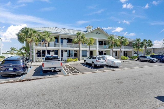 view of property featuring uncovered parking